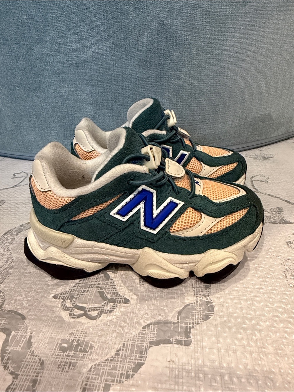 New Balance Kids Dark Green and Beige Sneakers with Blue Logo